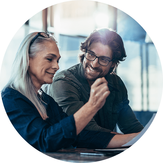 Two IT professionals collaborating and discussing digital solutions, representing 1BRTech's IT support and consulting services in Sri Lanka.